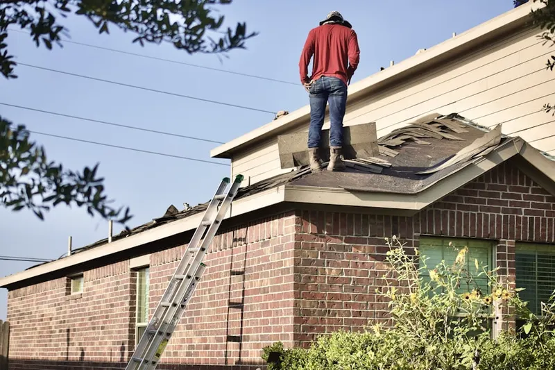 Professional roofer working on a residential roof in Rancho San Rafael